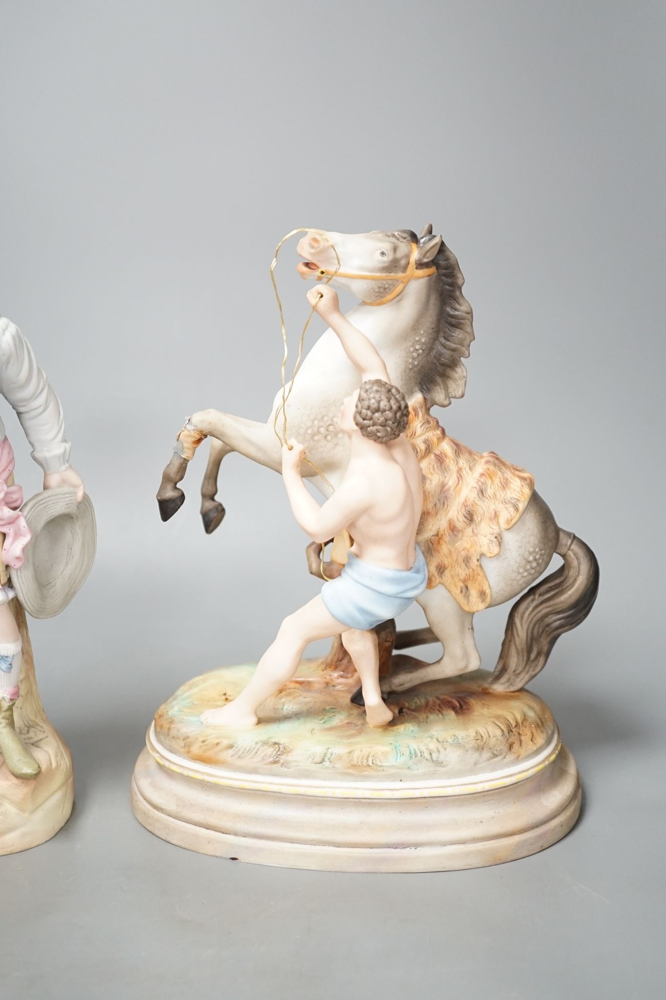 A pair of French bisque Marly horse groups and two pairs of French porcelain figures 27cm